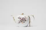 A Berlin KPM porcelain teapot with tri-coloured flowers by Königliche Porzellanmanufaktur Berlin Kpm, offered Apr 2023