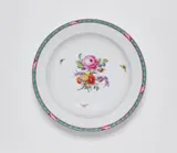 A round Berlin KPM porcelain platter from a dinner service with an oak leaf border by Königliche Porzellanmanufaktur Berlin Kpm, offered Apr 2023