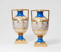 Königliche Porzellanmanufaktur Berlin Kpm, A pair of Berlin KPM porcelain vases with amoretti