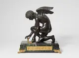 Antoine-Denis Chaudet, L' Amour, Gilt and patinated bronze figure of Cupid with a butterfly and a rose, kneeling on a dark green marble base. H 45.5, W 44, D
