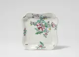Paul Hannong, A Strasbourg faience platter with "fleurs des Indes" decor, Rectangular platter painted in "petit feu" polychromy. Blue PH mark. Minor rim chips, traces of kiln ash in the borders