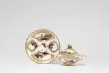 A Meissen porcelain ecuelle on stand with battle scenes by Meissen Royal Porcelain Manufactory, sold May 2022