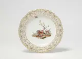 A Berlin KPM porcelain dessert plate from a service with animal decor by Königliche Porzellanmanufaktur Berlin Kpm, offered May 2022