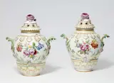 A pair of Berlin KPM porcelain potpourri vases with naturalistic flowers by Königliche Porzellanmanufaktur Berlin Kpm, sold May 2022