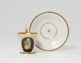 A Berlin KPM porcelain cup and saucer with faux cameo decor by Königliche Porzellanmanufaktur Berlin Kpm, offered May 2022