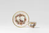 Meissen Royal Porcelain Manufactory, A Meissen porcelain tea bowl and saucer with landscape decor