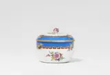 Meissen Royal Porcelain Manufactory, A Meissen porcelain sugar box with wildflowers and a blue ribbon