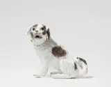 Meissen Royal Porcelain Manufactory, A Meissen porcelain figure of a spaniel dog