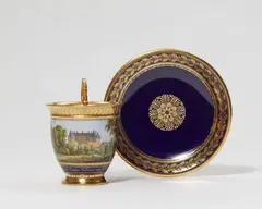 A Sèvres porcelain cup with a view of Ecouen Palace by Sèvres, sold Nov 2021
