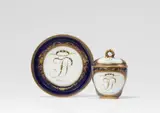 Meissen Royal Porcelain Manufactory, A Meissen porcelain lidded cup and saucer 'Kutenzow'