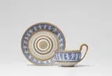 Meissen Royal Porcelain Manufactory, A Meissen porcelain cup and saucer with Wedgewood style reliefs