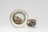Meissen Royal Porcelain Manufactory, A Meissen porcelain cup and saucer with Greek and Roman ruins