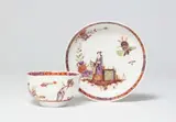 Johann Ehrenfried Stadler, A Meissen porcelain tea bowl and saucer with Chinoiserie figures