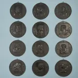 Leonhard Posch, A complete set of cast iron plaques with the 12 Apostles, Black patinated cast iron. Holy Spirit, two with vase motifs above and still lifes below. Engraved with letters and numbers. D c