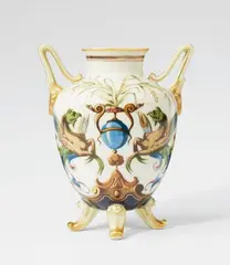 Hermann Seger, A Berlin KPM porcelain vase with grotesques, Unidentified model. Seger porcelain vase with pale green glaze. Blue sceptre mark with Sgr.P. H