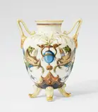 Hermann Seger, A Berlin KPM porcelain vase with grotesques, Unidentified model. Seger porcelain vase with pale green glaze. Blue sceptre mark with Sgr.P. H