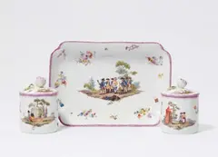 Andreas Oettner, A pair of Meissen porcelain beakers and covers with military scenes