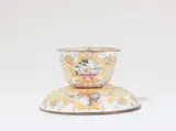 Christian Frederich Herold, An "émail de Saxe" tea bowl and saucer