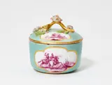 Meissen Royal Porcelain Manufactory, A round Meissen porcelain celadon ground sugar box and a saucer with battle scenes