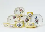 Meissen Royal Porcelain Manufactory, Eleven items of Meissen porcelain with yellow ground and woodcut flowers