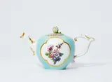 Meissen Royal Porcelain Manufactory, A Meissen porcelain teapot with celadon green ground and woodcut flowers