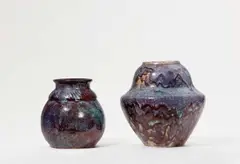 Eugène Lion, Two vases with gradient glaze decor, Red salt glazed stoneware with aubergine and plum coloured glaze. Incised signature "Lion". H 18.6 and