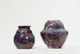 Eugène Lion, Two vases with gradient glaze decor, Red salt glazed stoneware with aubergine and plum coloured glaze. Incised signature "Lion". H 18.6 and