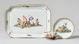 Nymphenburg, A Nymphenburg porcelain platter, cup, and saucer with peasant scenes