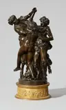Claude Michel called Clodion, A bronze group with maenads and a satyr, Cast bronze with golden brown patina and ormolu. Three-figure group on a round base with a frieze of putti. H