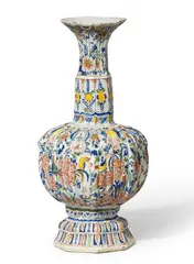 Gerhard Wolbeer, A ribbed Berlin faience vase with peacock decor