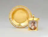 Imperial Manufactory Vienna, A Vienna porcelain cup and saucer with a portrait of a young lady