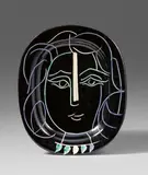 Pablo Picasso, Visage de femme, 1953, Oval ceramic plate. White clay with black, green, blue and white engobe painting, glazed and with incised decor; ceramic, Madoura edition