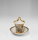 Fürstenberg, A Fürstenberg porcelain cup with a scene of porcelain making