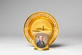 Imperial Manufactory Vienna, A pair of Vienna porcelain cups and saucers made for Sigismund Friedrich Khevenhüller Metsch