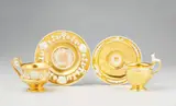 Imperial Manufactory Vienna, Two Vienna gilt porcelain cups with relief decor