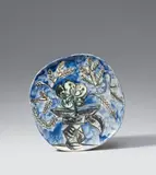 Vase au bouquet by Pablo Picasso, 1956, Ceramic plate. Slightly irregular outline, white clay. Sculptural relief, painted in black, white-greenish and blue, gla, sold Jun 2018