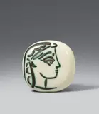 Profil de Jacqueline by Pablo Picasso, 1956, Convex ceramic wall plate. White clay with relief embossing and painted and glazed in black and greenish engobe; ceramic, sold Jun 2018