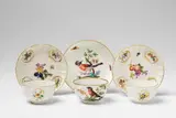A pair of Meissen porcelain teabowls with fruit decor by Meissen Royal Porcelain Manufactory, sold May 2018