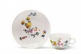 Wilhelm Caspar Wegely, A Wegely porcelain cup and saucer with scattered flowers