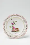 A Berlin KPM porcelain dessert plate with an overturned basket of flowers by Königliche Porzellanmanufaktur Berlin Kpm, sold Apr 2018