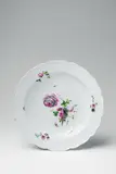 A round Berlin KPM porcelain platter with tri-coloured floral decor by Königliche Porzellanmanufaktur Berlin Kpm, offered Apr 2018