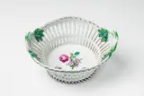 A Berlin KPM porcelain basket with a tri-coloured bouquet by Königliche Porzellanmanufaktur Berlin Kpm, sold Apr 2018