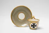 A Berlin KPM porcelain mocca cup with the Iron Cross by Königliche Porzellanmanufaktur Berlin Kpm, sold Apr 2018