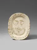 Visage d'homme by Pablo Picasso, 1955, Oval ceramic plate. White clay, patinated in grey, with three-dimensional relief decor, painted in light brown and ivory, sold Dec 2017
