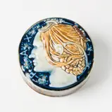 Sèvres, A Sèvres porcelain paperweight "Pax" by Taxile Doat