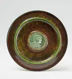 Sèvres, A Sèvres porcelain plate with Minerva by Taxile Doat, Mottled metal glazes with partial cracquelure, with coloured porcelain paste appliques