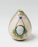 Sèvres, A Sèvres porcelain vase âne with two mascarons by Taxile Doat, Biscuit porcelain with seladon and blue glaze appliques, green borders, purple decor, and pâte-sur-pâte reliefs. TDOAT 1929 Sèvres. H