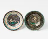 Jean Mayodon, Two porcelain bowls by Jean Mayodon, Porcelain with underglaze decor and crackle gilding on chamois-coloured ground. Gold JM in a reserve. H 5.3, D