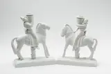 A pair of facing white porcelain candlesticks formed as horsemen by Meissen Royal Porcelain Manufactory, sold Nov 2017