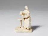 A small Zurich stoneware figure of a lady drinking coffee by Zürcher Porzellanfabrik in Schooren, sold Nov 2017